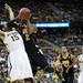 Michigan sophomore Jon Horford tries to defend a shot from Virginia Commonwealth sophomore Briante Weber on Saturday, March 23. Daniel Brenner I AnnArbor.com